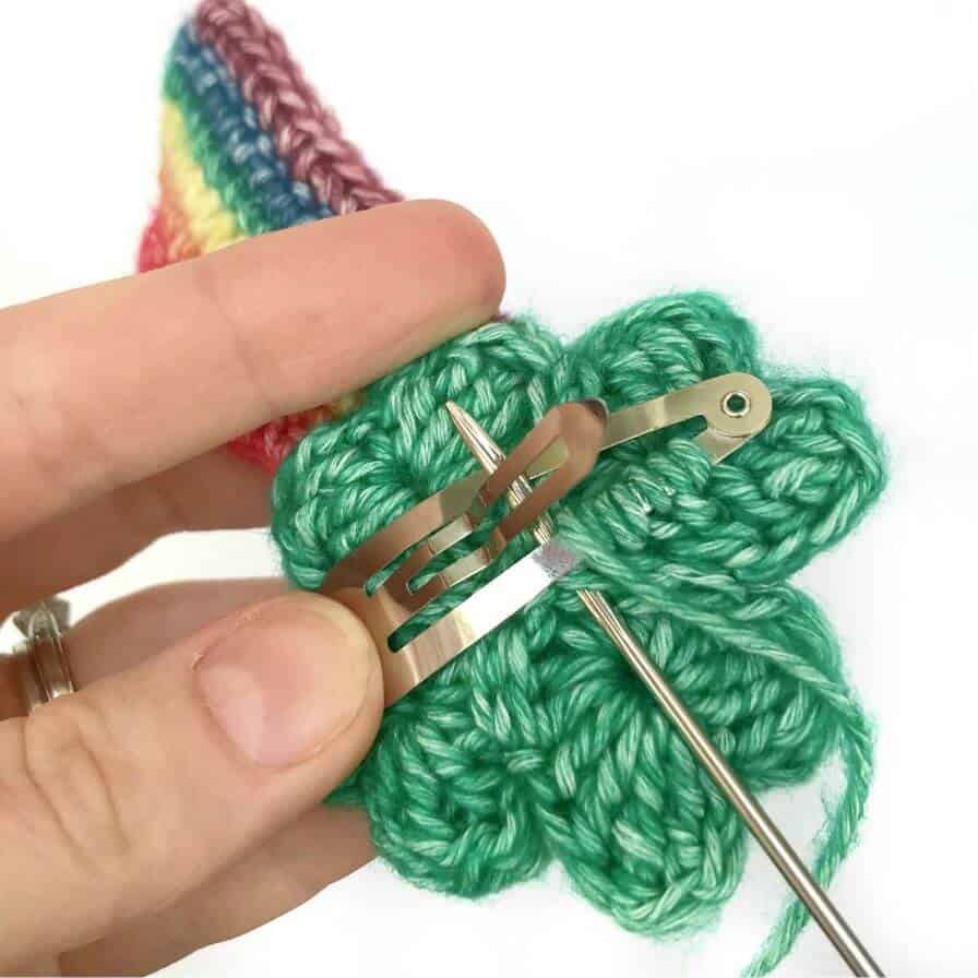 Back of crochet shamrock with clip