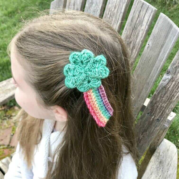 crochet shamrock hair clip being worn