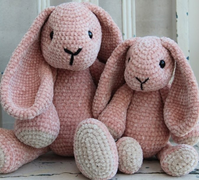 Crochet bunnies made in two sizes in pink velvet yarn